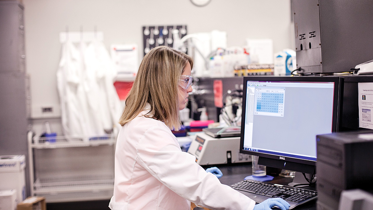 Student working in a laboratory on a computer.