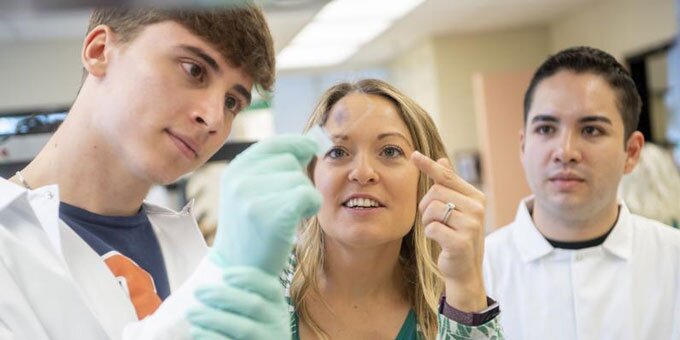 Students working in a lab with their instructor