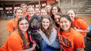 Animal Sciences Ambassadors with a black dog