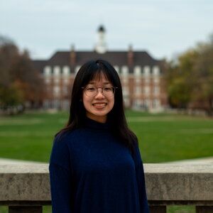 girl in classes posed on university quad