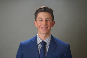 male student in blue suit jacket